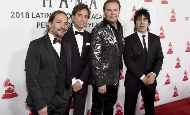 FILE - Sergio Vallin, from left, Juan Calleros, Fher Olvera and Alex Gonzalez, of Mana, appear at the Latin Recording Academy Person of the Year gala in their honor on Nov. 14, 2018. (Photo by Chris Pizzello/Invision/AP, File)