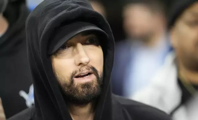 FILE - Eminem is seen during pregame of an NFL wild-card playoff football game, Jan. 14, 2024, in Detroit. (AP Photo/Paul Sancya, file)