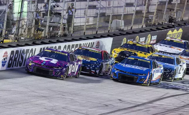 Alex Bowman (48) leads Kyle Larson (5) and Martin Truex Jr. (19) at the start of a NASCAR Cup Series auto race, Saturday, Sept. 21, 2024, in Bristol, Tenn. (AP Photo/Wade Payne)