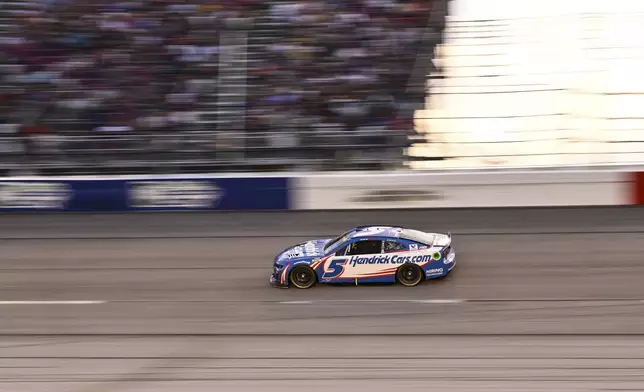 Kyle Larson steers through Turn 4 during a NASCAR Cup Series auto race at Darlington Raceway, Sunday, Sept. 1, 2024, in Darlington, S.C. (AP Photo/Matt Kelley)