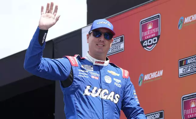 FILE - Kyle Busch is introduced before a NASCAR Cup Series auto race at Michigan International Speedway, Sunday, Aug. 18, 2024, in Brooklyn, Mich. (AP Photo/Carlos Osorio, File)