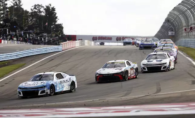 Ross Chastain (#1) drives into turn one during a NASCAR Cup Series auto race, Sunday, Sept. 15, 2024, in Watkins Glen, N.Y. (AP Photo/Lauren Petracca)