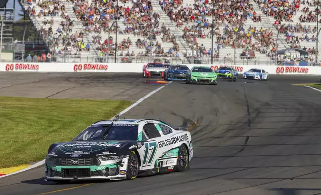 Chris Buescher (17) competes in a NASCAR Cup Series auto race, Sunday, Sept. 15, 2024, in Watkins Glen, N.Y. (AP Photo/Lauren Petracca)