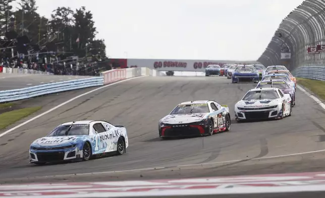 Ross Chasten (1) drives into Turn One during a NASCAR Cup Series auto race, Sunday, Sept. 15, 2024, in Watkins Glen, N.Y. (AP Photo/Lauren Petracca)