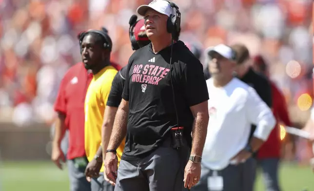 North Carolina State head coach Dave Doeren watches an instant replay on the scoreboard during the first half of an NCAA college football game against Clemson Saturday, Sept. 21, 2024, in Clemson, S.C. (AP Photo/Artie Walker Jr.)