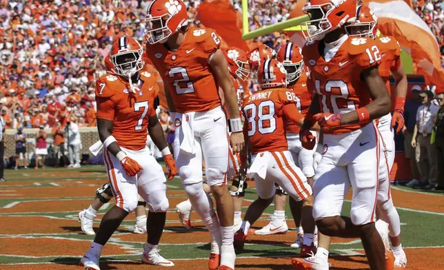 Clemson quarterback Cade Klubnik (2) celebrates a 55-yard touchdown run during the first half of an NCAA college football game against North Carolina State Saturday, Sept. 21, 2024, in Clemson, S.C. (AP Photo/Artie Walker Jr.)