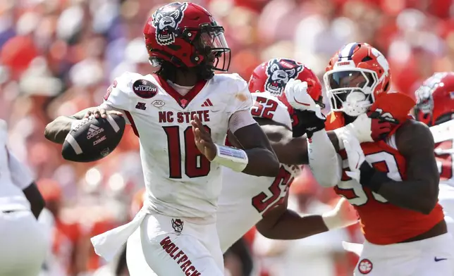 North Carolina State quarterback CJ Bailey (16) rolls out to pass during the first half of an NCAA college football game against Clemson Saturday, Sept. 21, 2024, in Clemson, S.C. (AP Photo/Artie Walker Jr.)