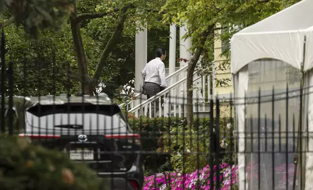 A person walks up the stairs to Gracie Mansion, the official residence of New York City Mayor Eric Adams, Thursday, Sep. 26, 2024, in New York. (AP Photo/Yuki Iwamura)