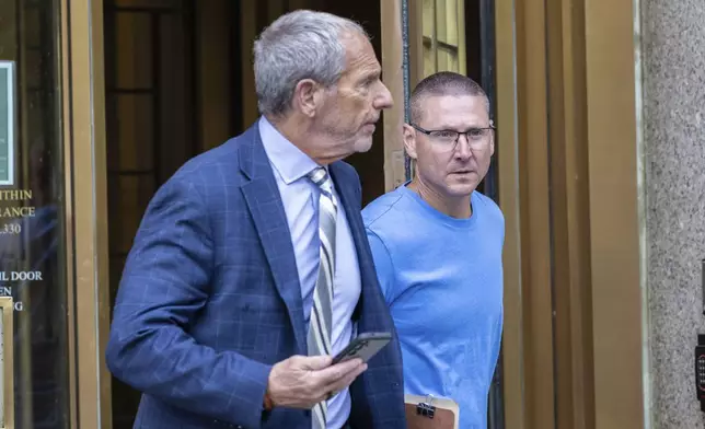 Retired New York City Fire Department Chief Brian Cordasco, right, and his lawyer Frank Rothman, leave federal court in New York, Monday Sept. 16, 2024. (AP Photo/Stefan Jeremiah)