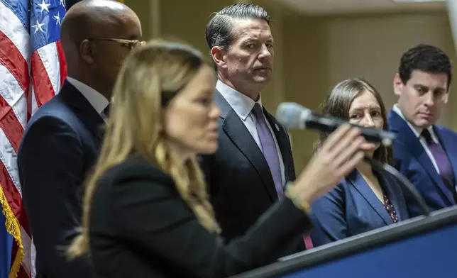 FBI New York Assistant Director in Charge, James E. Dennehy looks on as DOI Commissioner Jocelyn E. Strauber speaks at a press conference at Federal Plaza in New York, Monday Sept. 16, 2024, following the arrest of two former New York City Fire Department chiefs. (AP Photo/Stefan Jeremiah)