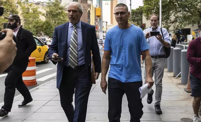 Retired New York City Fire Department Chief Brian Cordasco, right, and his lawyer Frank Rothman, leave federal court in New York, Monday Sept. 16, 2024. (AP Photo/Stefan Jeremiah)