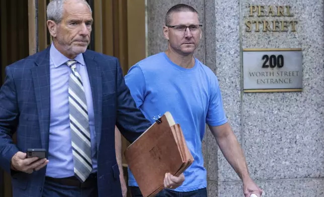 Retired New York City Fire Department Chief Brian Cordasco, right, and his lawyer Frank Rothman, leave federal court in New York, Monday Sept. 16, 2024. (AP Photo/Stefan Jeremiah)