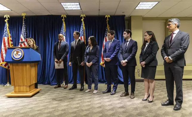 New York City Department of Investigation Commissioner Jocelyn E. Strauber, speaks as Manhattan-based U.S. Attorney Damian Williams, left, and FBI New York Assistant Director in Charge, James E. Dennehy, second from left, look on during a press conference at Federal Plaza in New York, Monday Sept. 16, 2024. (AP Photo/Stefan Jeremiah)