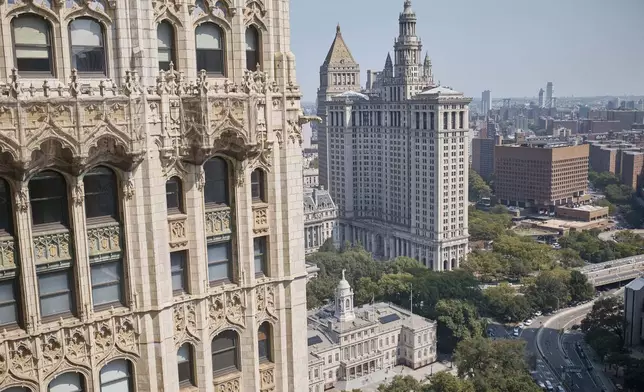 Cars move along Park Row street next to the New York City Hall, bottom center, Friday, Sept. 13, 2024, in New York. (AP Photo/Andres Kudacki)