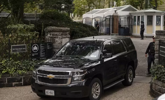 A vehicle drives out of Gracie Mansion, the official residence of New York City Mayor Eric Adams, Thursday, Sep. 26, 2024, in New York. (AP Photo/Yuki Iwamura)