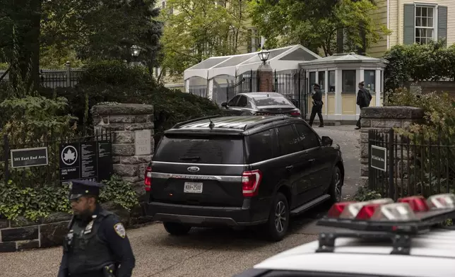 A vehicle drives into Gracie Mansion, the official residence of New York City Mayor Eric Adams, Thursday, Sep. 26, 2024, in New York. (AP Photo/Yuki Iwamura)