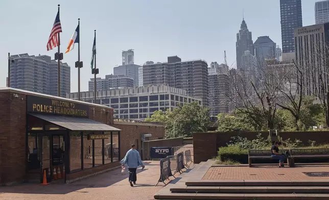 A man walks outside One Police Plaza NYPD Headquarters on Friday, Sept. 13, 2024, in New York. (AP Photo/Andres Kudacki)