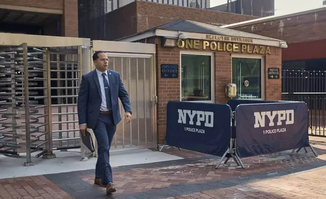 A man leaves the One Police Plaza NYPD Headquarters on Friday, Sept. 13, 2024, in New York. (AP Photo/Andres Kudacki)