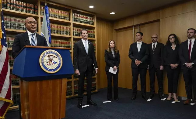 U.S. Attorney Damian Williams, left, speaks at a news conference detailing an indictment against New York City Mayor Eric Adams, Thursday, Sept. 26, 2024, in New York. (AP Photo/Julia Demaree Nikhinson)