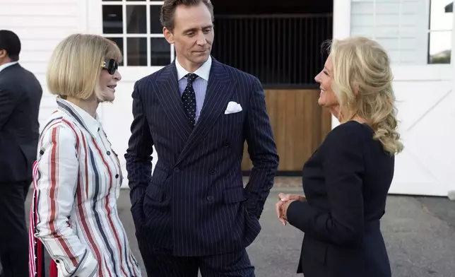 Anna Wintour, from left, Tom Hiddleston and First Lady of the United States, Dr. Jill Biden attend the Ralph Lauren Spring/Summer 2025 fashion show as part of New York Fashion Week on Thursday, Sept. 5, 2024, at Khalily Stables in Bridgehampton, N.Y. (Photo by Charles Sykes/Invision/AP)