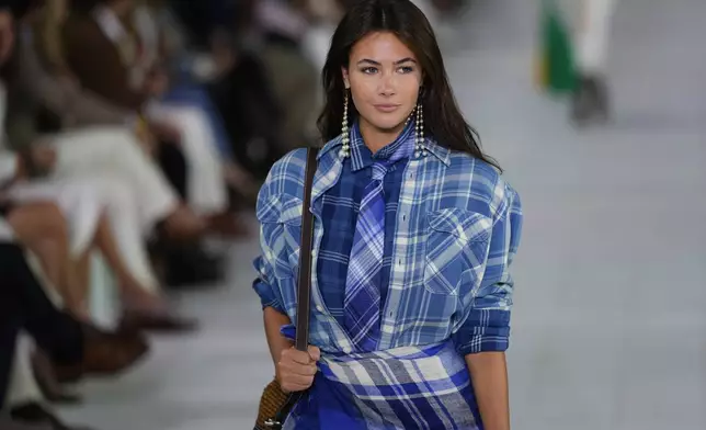 A model walks the runway during the Ralph Lauren Spring/Summer 2025 fashion show as part of New York Fashion Week on Thursday, Sept. 5, 2024, at Khalily Stables in Bridgehampton, N.Y. (Photo by Charles Sykes/Invision/AP)