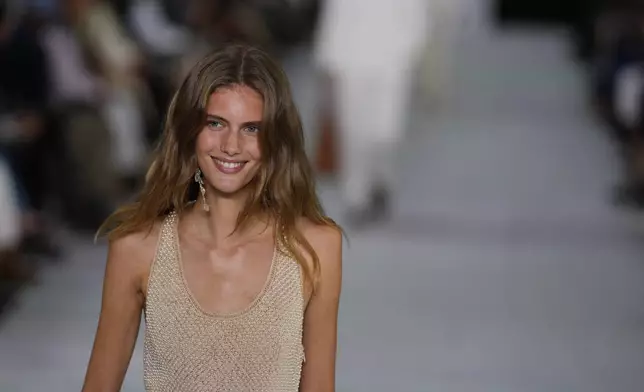 A model walks the runway during the Ralph Lauren Spring/Summer 2025 fashion show as part of New York Fashion Week on Thursday, Sept. 5, 2024, at Khalily Stables in Bridgehampton, N.Y. (Photo by Charles Sykes/Invision/AP)