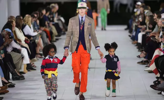 Models walk the runway during the Ralph Lauren Spring/Summer 2025 fashion show as part of New York Fashion Week on Thursday, Sept. 5, 2024, at Khalily Stables in Bridgehampton, N.Y. (Photo by Charles Sykes/Invision/AP)