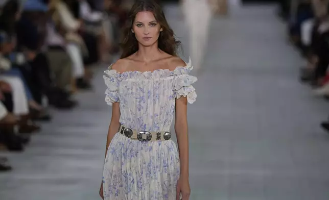 A model walks the runway during the Ralph Lauren Spring/Summer 2025 fashion show as part of New York Fashion Week on Thursday, Sept. 5, 2024, at Khalily Stables in Bridgehampton, N.Y. (Photo by Charles Sykes/Invision/AP)