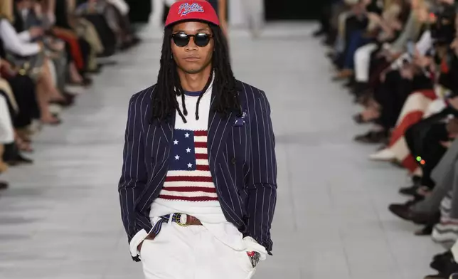 A model walks the runway during the Ralph Lauren Spring/Summer 2025 fashion show as part of New York Fashion Week on Thursday, Sept. 5, 2024, at Khalily Stables in Bridgehampton, N.Y. (Photo by Charles Sykes/Invision/AP)