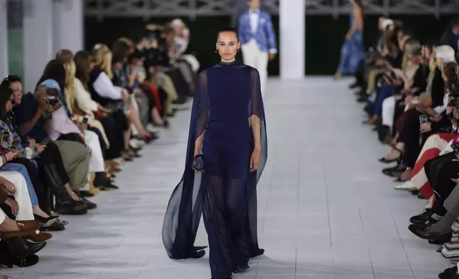 A model walks the runway during the Ralph Lauren Spring/Summer 2025 fashion show as part of New York Fashion Week on Thursday, Sept. 5, 2024, at Khalily Stables in Bridgehampton, N.Y. (Photo by Charles Sykes/Invision/AP)