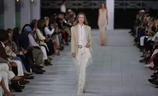 A model walks the runway during the Ralph Lauren Spring/Summer 2025 fashion show as part of New York Fashion Week on Thursday, Sept. 5, 2024, at Khalily Stables in Bridgehampton, N.Y. (Photo by Charles Sykes/Invision/AP)