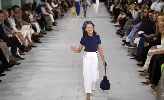 A model walks the runway during the Ralph Lauren Spring/Summer 2025 fashion show as part of New York Fashion Week on Thursday, Sept. 5, 2024, at Khalily Stables in Bridgehampton, N.Y. (Photo by Charles Sykes/Invision/AP)