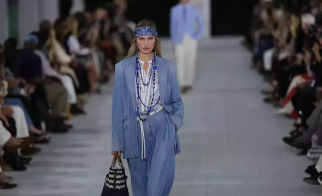 A model walks the runway during the Ralph Lauren Spring/Summer 2025 fashion show as part of New York Fashion Week on Thursday, Sept. 5, 2024, at Khalily Stables in Bridgehampton, N.Y. (Photo by Charles Sykes/Invision/AP)