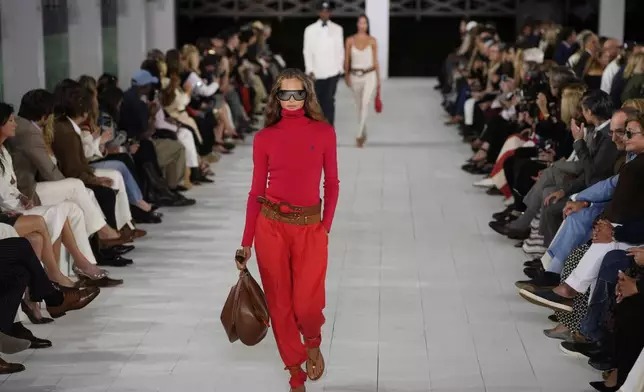 A model walks the runway during the Ralph Lauren Spring/Summer 2025 fashion show as part of New York Fashion Week on Thursday, Sept. 5, 2024, at Khalily Stables in Bridgehampton, N.Y. (Photo by Charles Sykes/Invision/AP)