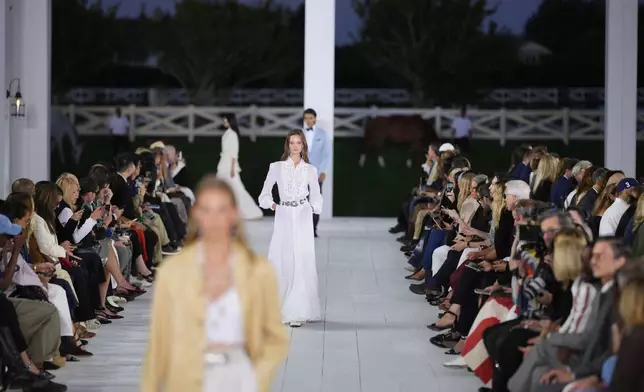 Models walk the runway during the Ralph Lauren Spring/Summer 2025 fashion show as part of New York Fashion Week on Thursday, Sept. 5, 2024, at Khalily Stables in Bridgehampton, N.Y. (Photo by Charles Sykes/Invision/AP)