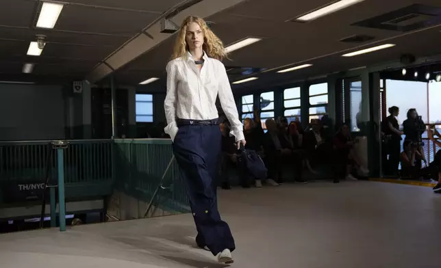 A model walks the runway during the Tommy Hilfiger Spring/Summer 2025 fashion show onboard a Staten Island Ferry as part of New York Fashion Week on Sunday, Sept. 8, 2024, in New York. (Photo by Charles Sykes/Invision/AP)