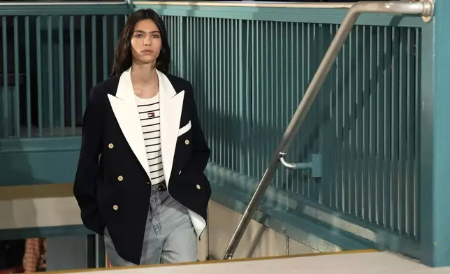 A model walks the runway during the Tommy Hilfiger Spring/Summer 2025 fashion show onboard a Staten Island Ferry as part of New York Fashion Week on Sunday, Sept. 8, 2024, in New York. (Photo by Charles Sykes/Invision/AP)