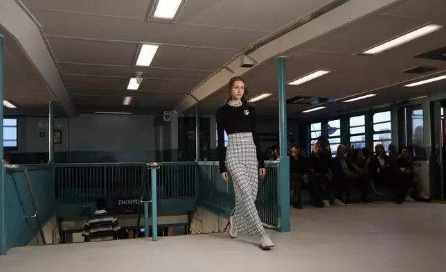 A model walks the runway during the Tommy Hilfiger Spring/Summer 2025 fashion show onboard a Staten Island Ferry as part of New York Fashion Week on Sunday, Sept. 8, 2024, in New York. (Photo by Charles Sykes/Invision/AP)