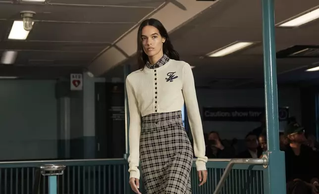 A model walks the runway during the Tommy Hilfiger Spring/Summer 2025 fashion show onboard a Staten Island Ferry as part of New York Fashion Week on Sunday, Sept. 8, 2024, in New York. (Photo by Charles Sykes/Invision/AP)