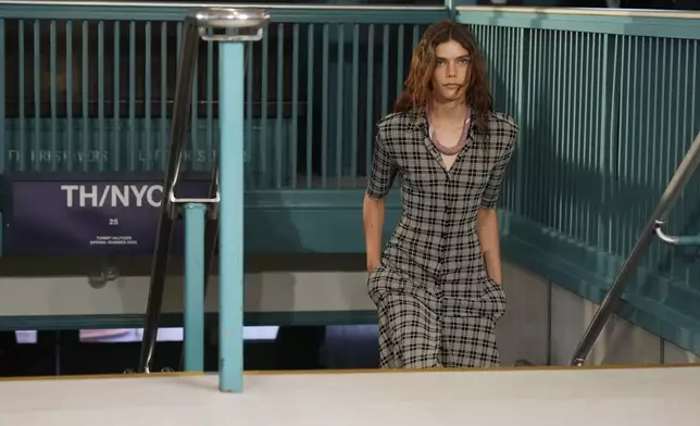 A model walks the runway during the Tommy Hilfiger Spring/Summer 2025 fashion show onboard a Staten Island Ferry as part of New York Fashion Week on Sunday, Sept. 8, 2024, in New York. (Photo by Charles Sykes/Invision/AP)