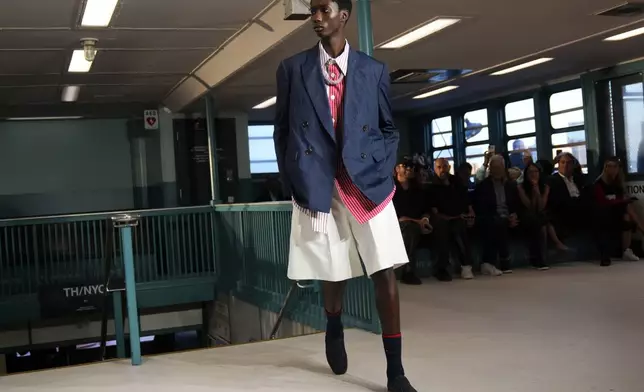 A model walks the runway during the Tommy Hilfiger Spring/Summer 2025 fashion show onboard a Staten Island Ferry as part of New York Fashion Week on Sunday, Sept. 8, 2024, in New York. (Photo by Charles Sykes/Invision/AP)