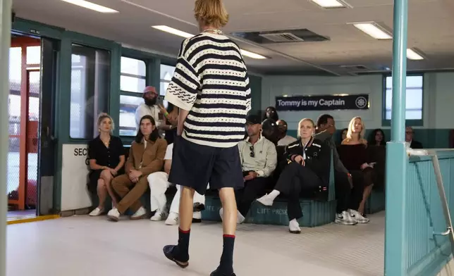 A model walks the runway during the Tommy Hilfiger Spring/Summer 2025 fashion show onboard a Staten Island Ferry as part of New York Fashion Week on Sunday, Sept. 8, 2024, in New York. (Photo by Charles Sykes/Invision/AP)