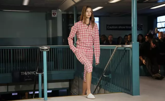 A model walks the runway during the Tommy Hilfiger Spring/Summer 2025 fashion show onboard a Staten Island Ferry as part of New York Fashion Week on Sunday, Sept. 8, 2024, in New York. (Photo by Charles Sykes/Invision/AP)