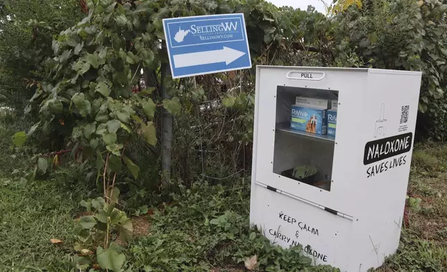 A new naloxone distribution box sits in a residential neighborhood in Hurricane, W.Va. on Tuesday, Sept. 24, 2024. (AP Photo/Leah Willingham)