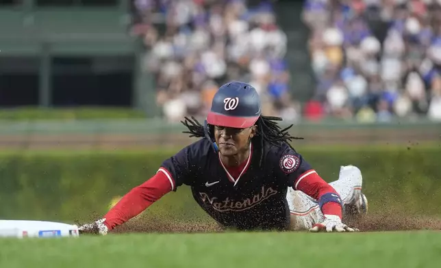 Washington Nationals' CJ Abrams steals third base during the first inning of a baseball game against the Chicago Cubs, Thursday, Sept. 19, 2024, in Chicago. (AP Photo/Erin Hooley)