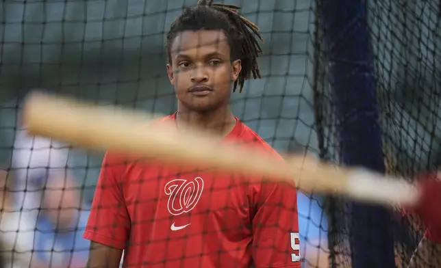 Washington Nationals' CJ Abrams watches batting practice before a baseball game against the Chicago Cubs, Thursday, Sept. 19, 2024, in Chicago. (AP Photo/Erin Hooley)