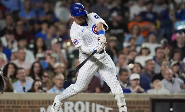 Chicago Cubs designated hitter Seiya Suzuki hits a two-run home run during the third inning of a baseball game against the Washington Nationals, Thursday, Sept. 19, 2024, in Chicago. (AP Photo/Erin Hooley)