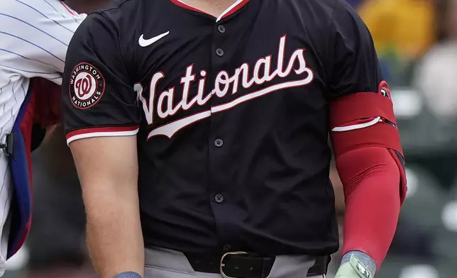 Washington Nationals' Juan Yepez looks to the field after string out swinging during the first inning of a baseball game against the Chicago Cubs in Chicago, Sunday, Sept. 22, 2024. (AP Photo/Nam Y. Huh)