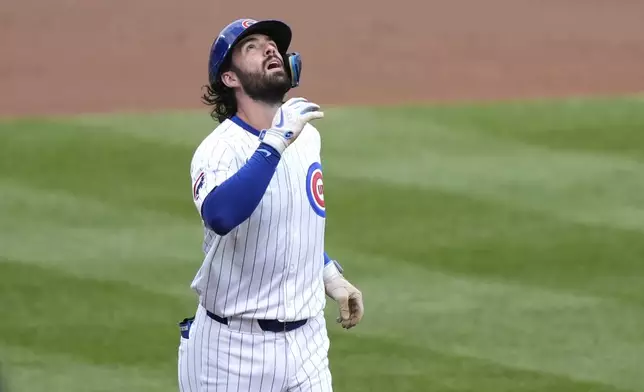 Chicago Cubs' Dansby Swanson celebrates his home run off Washington Nationals starting pitcher Trevor Williams during the first inning of a baseball game Friday, Sept. 20, 2024, in Chicago. (AP Photo/Charles Rex Arbogast)