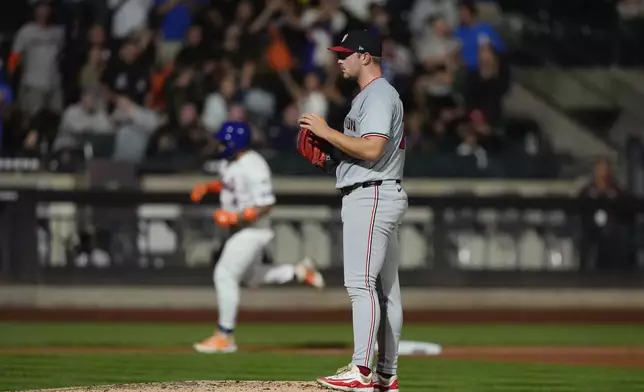 Washington Nationals pitcher Mitchell Parker reacts as New York Mets' Francisco Alvarez runs the bases after hitting a home run during the fourth inning of a baseball game, Tuesday, Sept. 17, 2024, in New York. (AP Photo/Frank Franklin II)